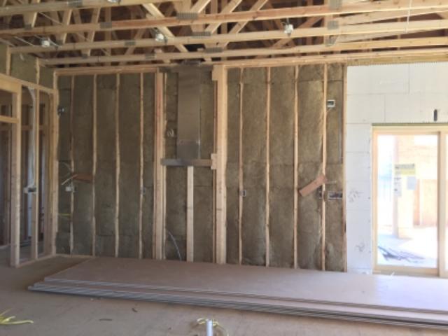 Garage walls are insulated with batts, while 11-inch-thick ICF walls wrap the living spaces in R-50 of thermal protection.