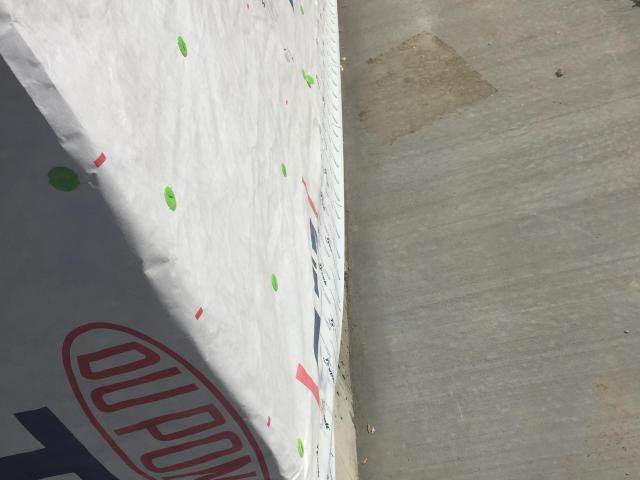 Two layers of house wrap shed water behind the stucco siding.