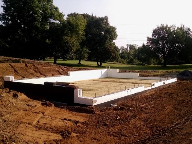 Insulated concrete forms create a sturdy base for the basement floor slab, which is poured over 4.5 inches of closed-cell spray foam.