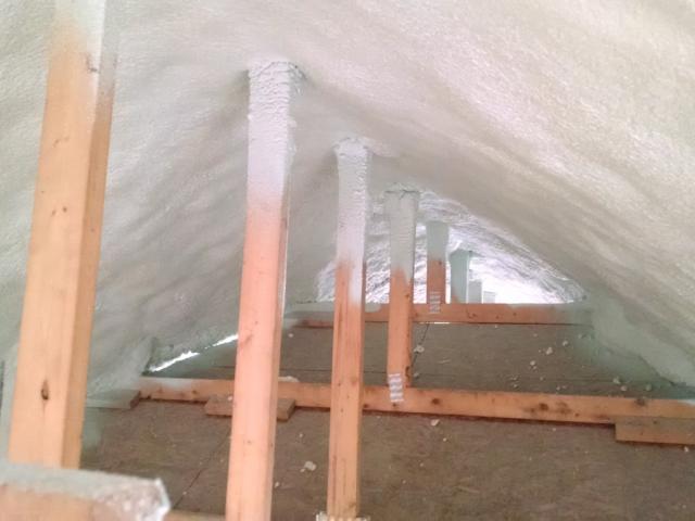 The unvented attic is insulated on the underside of the roof deck with 10.5 inches of open-cell spray foam plus 2.5 inches of closed-cell spray foam to provide a protected space for the HVAC equipment.