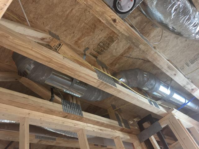 All of the HVAC system ducts are fully sealed with mastic and installed between floors in the open-web floor joists.