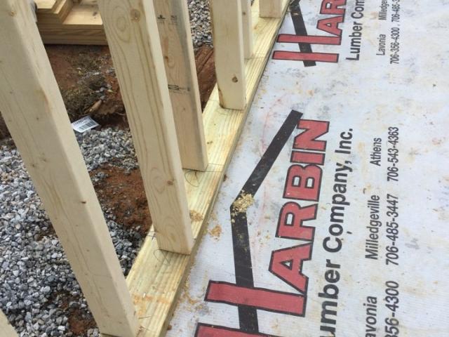 The walls consist of 2-by-4 studs staggered on a 2-by-6 plate, leaving space to wrap insulation around one edge of each stud; this stops thermal bridging or the passage of heat through the wall studs.