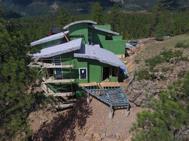 Extensive trenching was installed under the site to drain away surface water and snow melt to minimize erosion damage to the site and increase building durability.