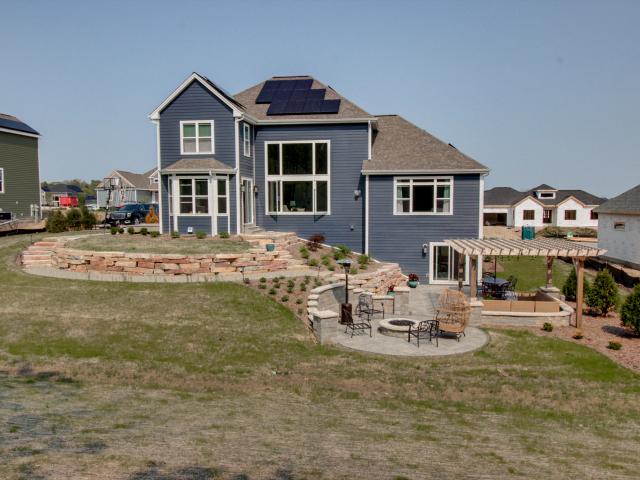 The walls of the home are stuffed with dense-packed fiberglass and wrapped in a 1-1/6-inch layer of graphite-enhanced EPS rigid foam while the ceilings are covered with a half-inch air-sealing layer of closed-cell spray foam then blanketed with R-50 of blown fiberglass to surround the homeowners with a thick blanket of protection.