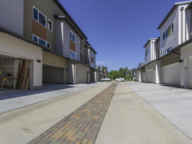 Properly flashed fiber-cement-siding-clad walls, shed roofs, and exterior grading that slopes to drainage help minimize the risk of water damage in and around the durable homes.