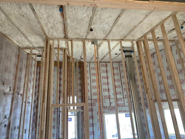 The vaulted ceilings were covered with 14 inches of open-cell spray foam insulation to provide R-50 of wall insulation value.