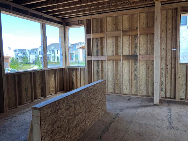 Thrive Home Builders constructs 9.5-inch-thick exterior walls and stuffs them with R-40 of blown fiberglass insulation.