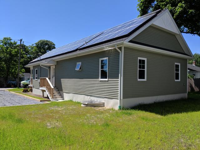 The compact house design and rectangular shape are the start of a super-efficient home that earned a HERS score of -15, which means it produces more power than the home will use, so there may be power left over to run an electric car or sell back to the grid.