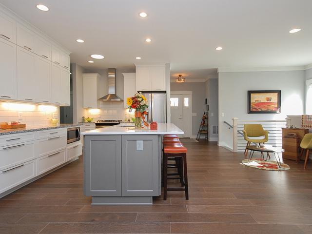 Strategically placed windows and solar tubes like the one in this kitchen supplement the ultra-efficient LED lighting fixtures to reduce electric loads in this efficient home.