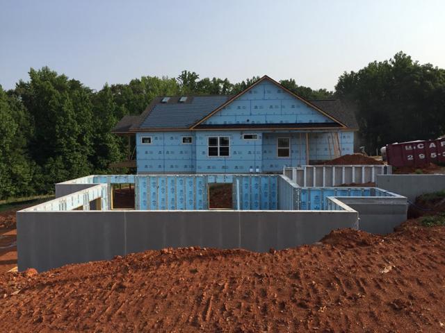 The daylight basement is wrapped in a continuous blanket of insulation with R-16 rigid foam integrated into the precast concrete walls.