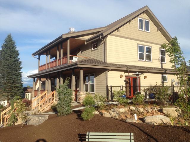 A standing-seam steel roof with deep overhangs, and dry-by-design walls of fiber cement plank siding over draining house wrap help to keep the home dry in the often-damp Pacific Northwest climate.