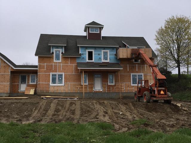 Every seam in the plywood was taped before installing house wrap to improve the home's airtightness.