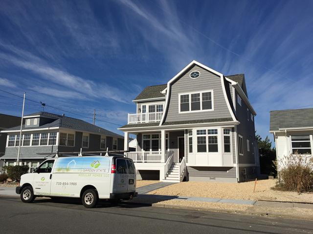 This beach house is built on a wood pile foundation with ventilated skirt walls and is insulated under the raised first floor with R-24 of closed-cell spray foam.