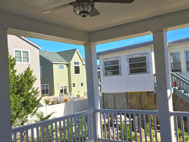 Porches, balconies, and operable windows encourage occupants to open windows to catch ocean breezes for natural cooling and ventilation.