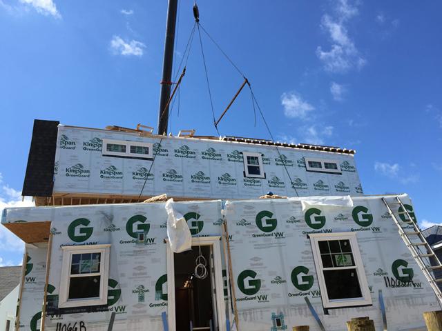 Each floor of the two-story home consists of 2-by-6, 24-inch on-center walls that are constructed in a factory and insulated with R-21 fiberglass batt plus 1 inch of rigid exterior foam, then connected on site.