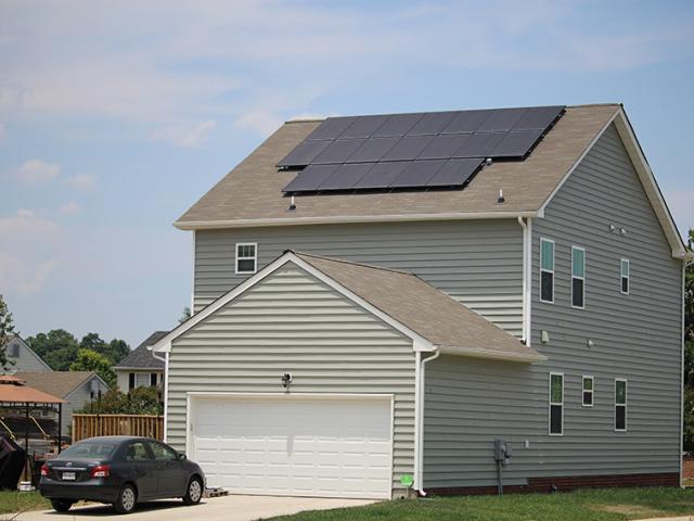 The home's alley-facing garage shares only one wall with the living space of the home, simplifying air-sealing to keep contaminants out of this EPA Indoor airPLUS-certified home.