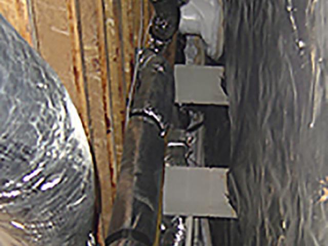 The crawlspace is air-sealed and insulated to provide a temperate place for HVAC ducts.