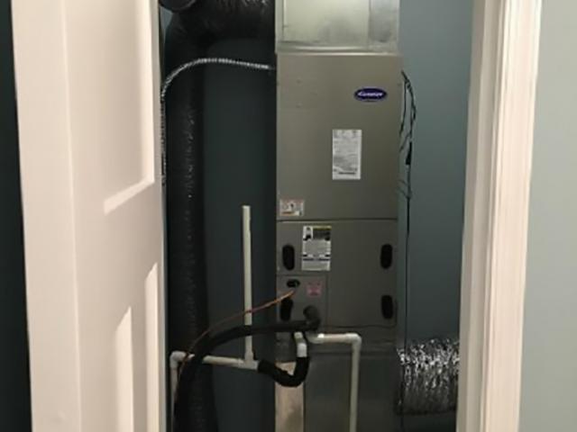 The home's efficient air-source heat pump is located in a closet inside the home.