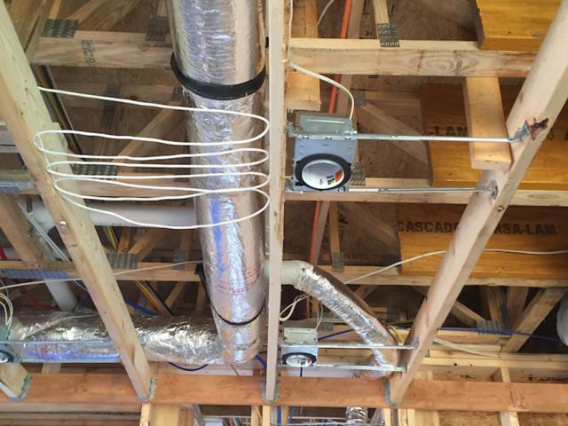 A small-duct, high-velocity heat pump system was chosen for its air distribution and dehumidification properties.