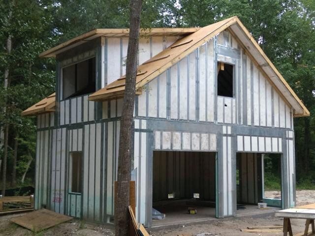 The garage and home are constructed from steel-framed expanded polystyrene wall panels with an R-34 insulation value.