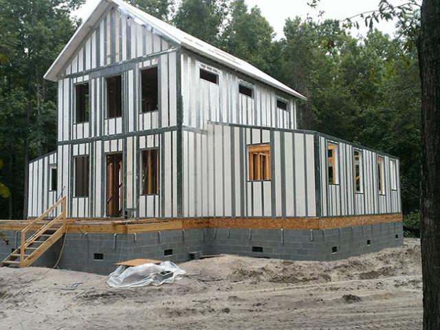 The polystyrene-and-steel walls are moisture-resistant and are designed to withstand winds up to 200 mph and level D seismic forces.