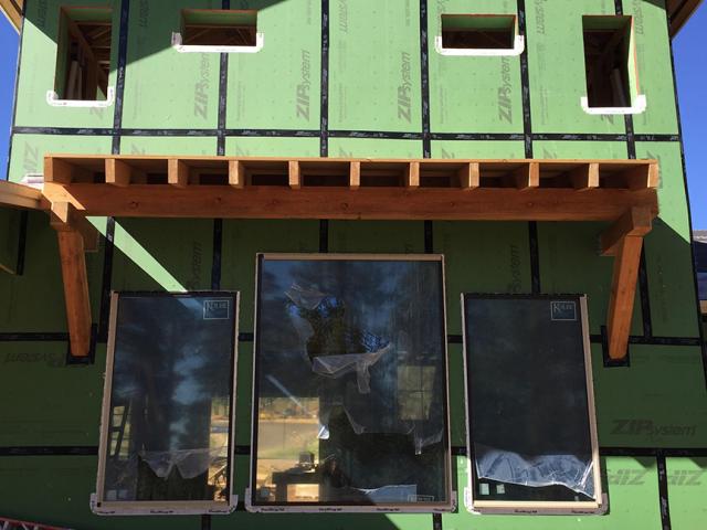 The coated OSB sheathing was taped at all seams to form an airtight and waterproof barrier.