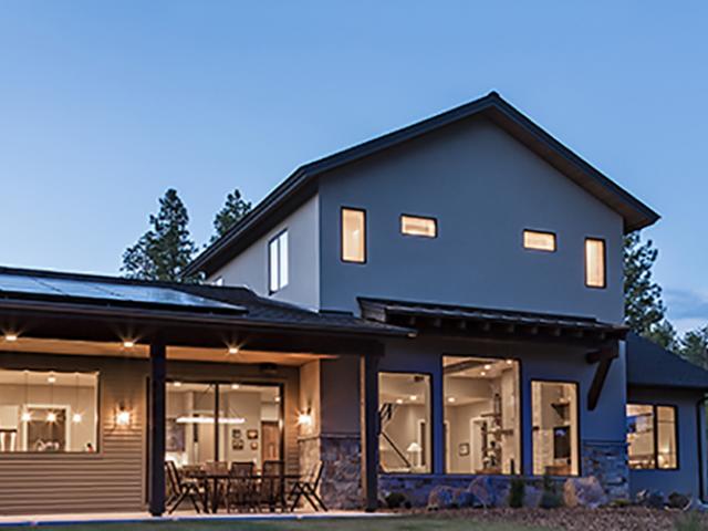 Awnings, overhangs, and porches shield windows and doors from sun, rain, and snow in this mountain locale.