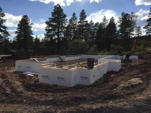 The conditioned crawlspace was insulated by installing 2 inches of rigid foam on each side of the concrete stem wall.