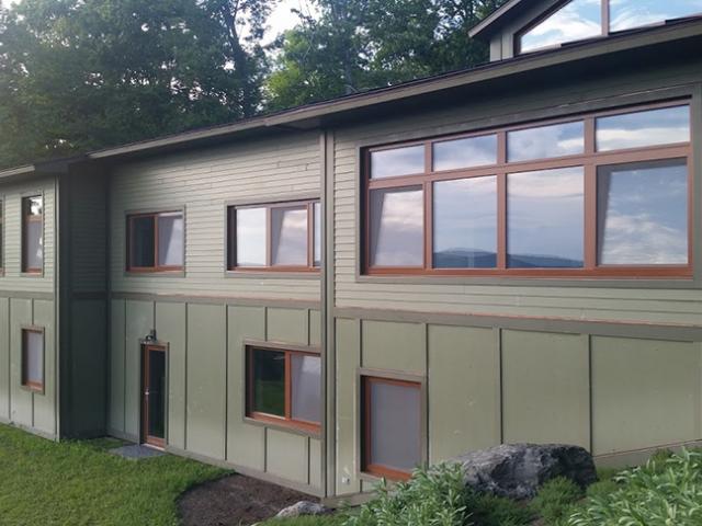 Beneath the fiber-cement siding is an unusual building material -- the home was constructed as the first aerated autoclaved concrete certified Passive House in the United States.