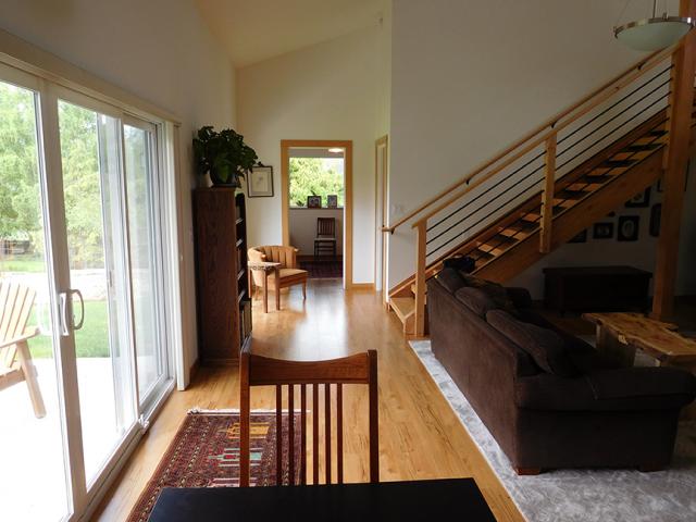 Most of the home’s triple-glazed vinyl-framed, low-E windows and sliding doors face south to allow sunlight to warm up the concrete slab under the flooring for passive solar heat.