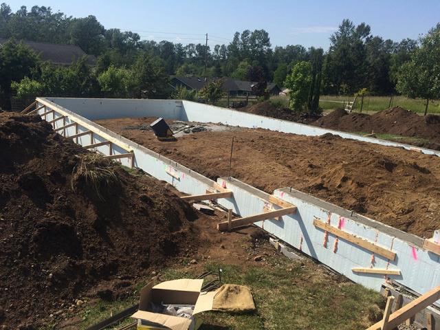 The home’s foundation walls were made of insulated concrete forms, which consist of rigid foam blocks that are stacked, reinforced with steel, and filled with concrete, providing insulated sides for the concrete floor slab.