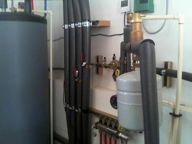 Domestic hot water is provided by the air-to-water heat pump, which also provides space heating.