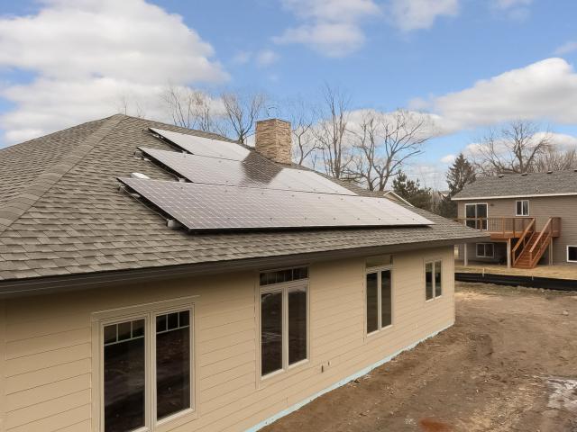 With the roof-mounted solar electric panels, this energy-efficient home is expected to save homeowners nearly $1,400 in annual utility expenses compared to a home built to minimum code.