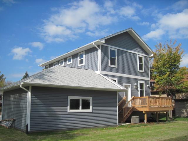 Deep overhangs shield second-story windows from sun, rain, and snow while ultra-efficient windows feature triple panes, insulated frames, argon gas fill between the panes, and an advanced low-emissivity coating to block heat loss.