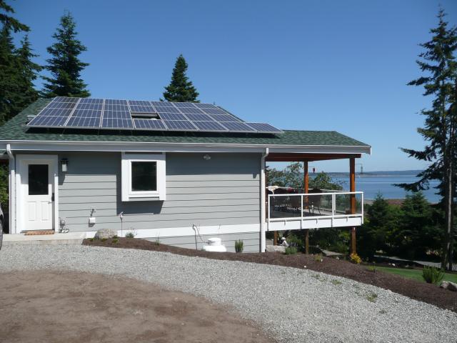 The ultra-efficient home has 7.84 kW of solar electric panels on the roof, which contribute to zero utility bills for the homeowners. The roof is built with structural insulated panels (SIPs) that are 10.25 inches thick and provide a continuous R-40 blanket of insulation.