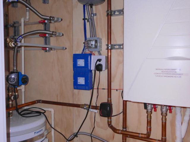 The same ultra-efficient air-to-water heat pump (COP 4.5) that provides hot water for the in-floor radiant heat also provides hot water to the home's showers and faucets.