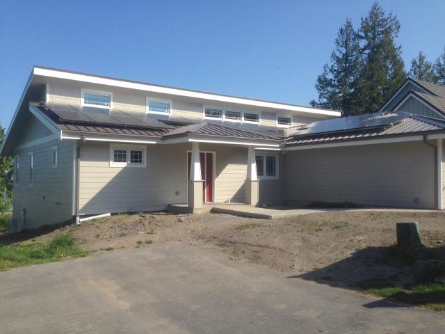 The ultra-efficient home has 7.56 kW of solar electric panels on the roof that help it to achieve annual energy bills of $35. The solar panels are installed on the durable, fire-resistant standing seam steel roof. The roofing is installed on a structural insulated panel (SIP) thermal blanket roof constructed with 10.25-inch thick panels (R-40).