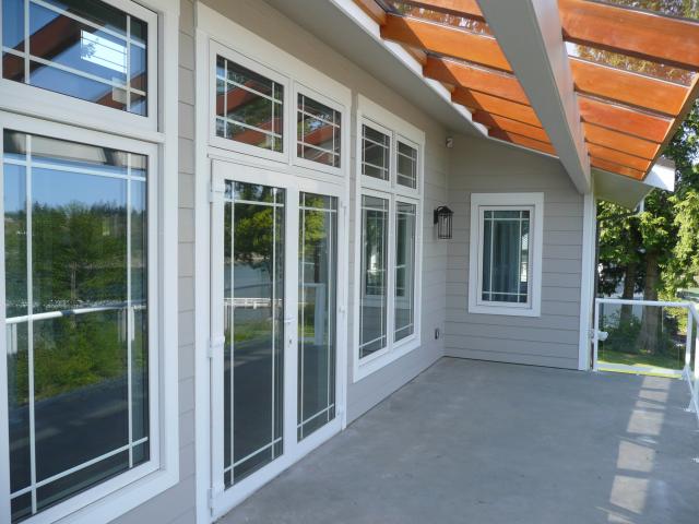 Ultra-efficient windows include triple-pane argon-filled glass with advanced low-emissivity coatings on three layers to reflect most of the winter sun back into the rooms from the wall of windows facing north to capture the view. South-facing clerestory, high-solar heat gain coefficient windows provide direct solar heating to these north-facing rooms.