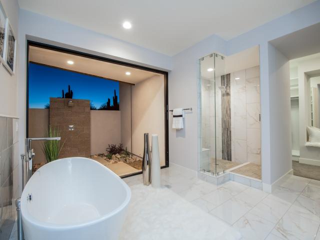 The master bath has an exterior shower, which helps keep steam and moisture out of the home.