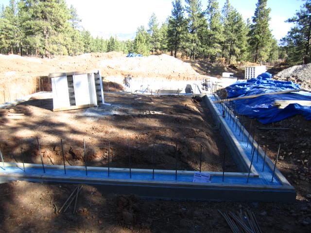 A vapor barrier separates the footing from the insulated concrete form (ICF) foundation walls to keep unwanted ground moisture from entering the home.