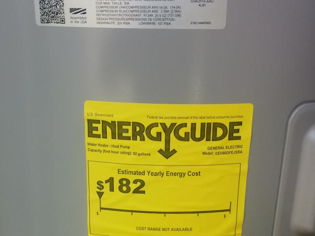 The high-efficiency heat pump water heater is centrally located in a laundry room so that all hot water uses are less than 15 feet from the tank.