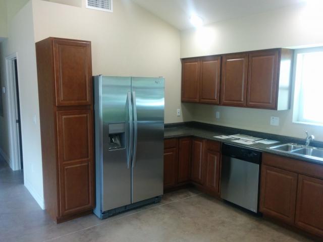 The kitchen is equipped with an energy-saving ENERGY STAR-certified refrigerator and dishwasher.