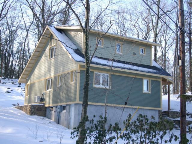 BPC Green earned a U.S. DOE Zero Energy Ready Home certification on this ultra-efficient lakeside cabin in west Connecticut.