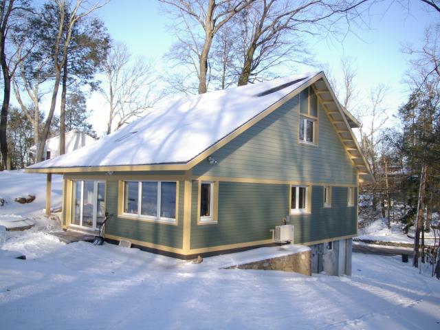 BPC Green's two-story cottage features a south-facing roof that provides maximum space to install solar panels in the future. In addition this roof orientation maximizes natural comfort  because the overhang allows low-angle sunlight through large south-facing windows in the winter and shades high-angle sunlight in the summer.