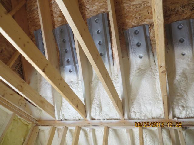 The ultra-efficient insulation system starts with a layer of closed-cell spray foam to seal up any cracks or holes in the exterior walls, which is supplemented with fiberglass batts inside the walls and a continuous thermal blanket of rigid foam on the exterior of the wall framing.