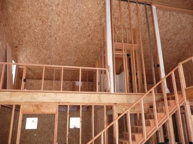 The walls and ceilings use structural insulated panel (SIP) construction with two layers of oriented strand board (OSB) sandwiching a 6- to 10-inch-thick layer of rigid foam insulation for a continuous thermal blanket around the entire home.