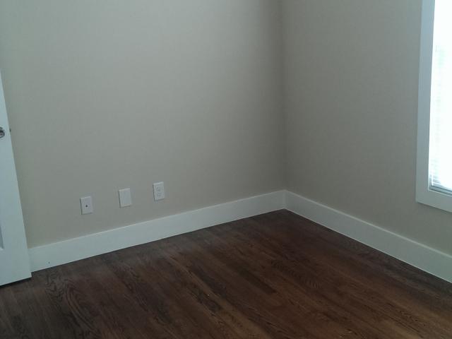 Original hardwood oak flooring was one of the few things retained from the interior of the existing home.