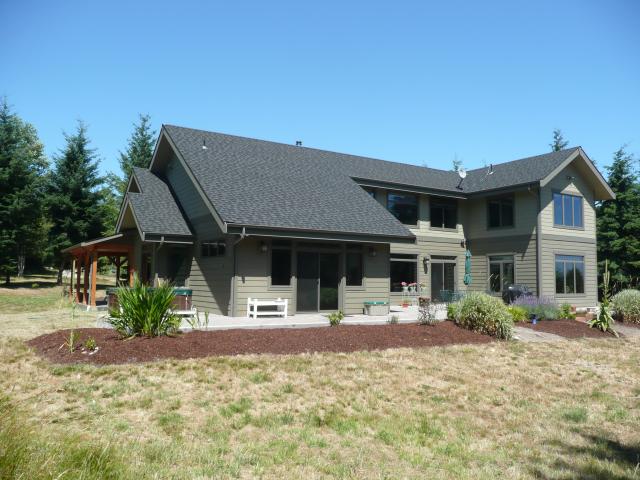 The roof design of this solar-electric-ready home has enough south-facing area to hold at least a 9 kW solar photovoltaic system, which can meet the electric needs of both the home and a car. All of the wiring is in place for solar panels on the rooftop and an electric vehicle charging station in the garage.