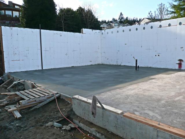 Advanced ICF technology, which is made of foam-insulation blocks filled with steel-reinforced concrete, is used for the foundation walls. This results in a quiet, highly insulated wall. In addition, 4 inches of rigid foam is also installed under the floor slab to hold the heat from radiant loops in the concrete slab for barefoot-friendly floors.