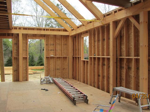 The studs of the double-wall construction are staggered to prevent thermal bridging through the framing for a continuous thermal blanket.